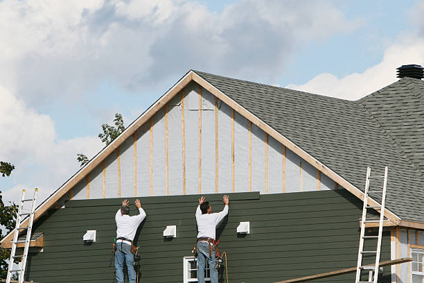 Professional Siding technician working in Aurora, IN